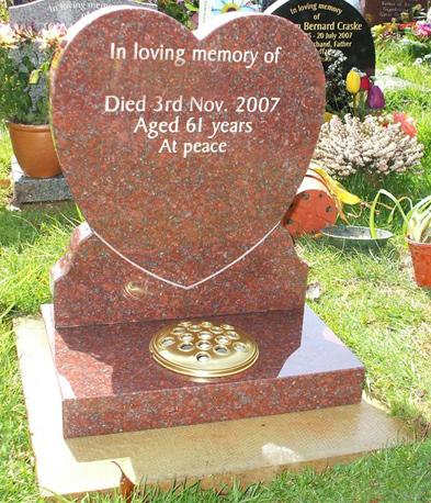 Red granite heart memorial with gold lettering