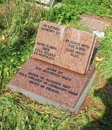 Red granite open book memorial