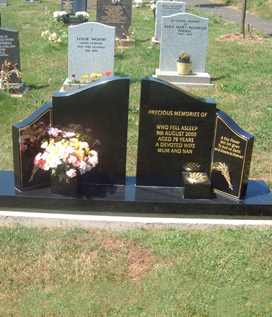 Black granite twin memorial with flower vases