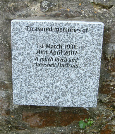 Grey granite tablet set into a wall